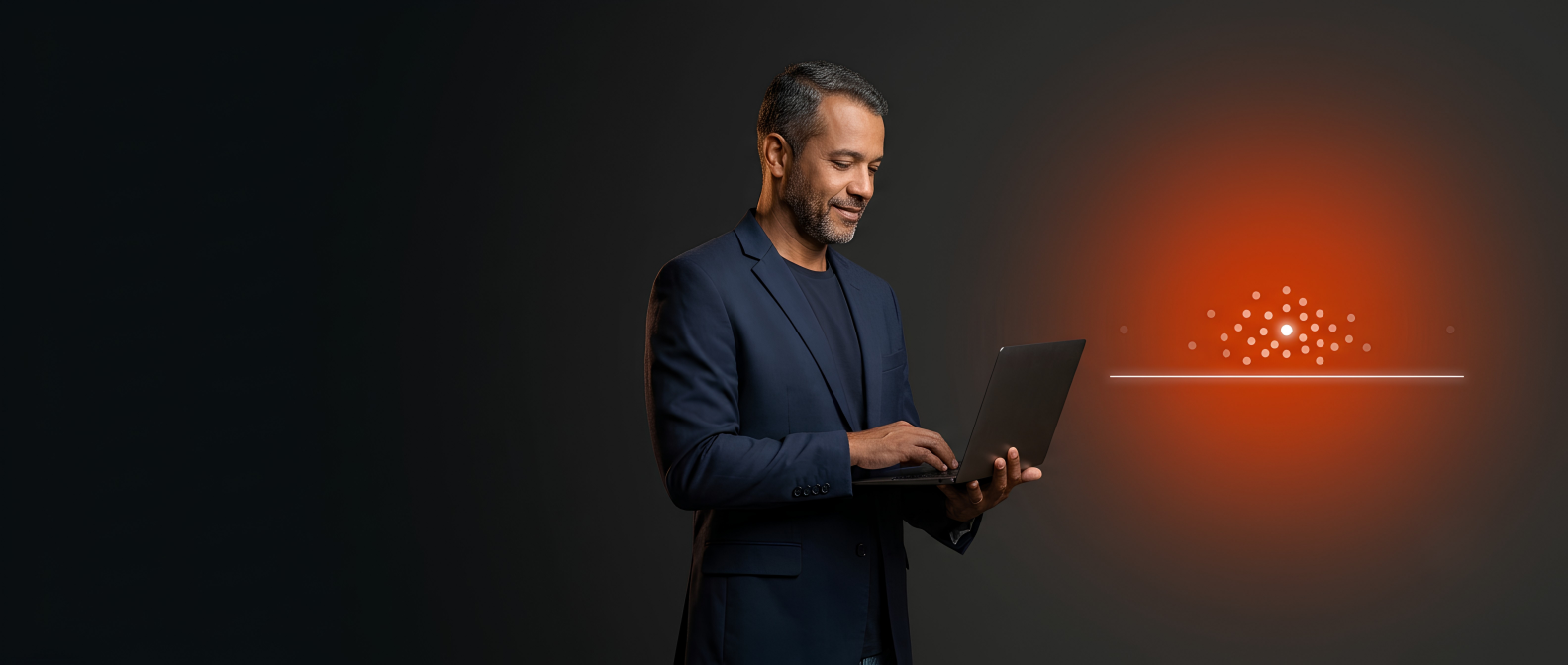 Homem de terno usando um notebook ao lado de um gráfico luminoso de pontos, sobre fundo escuro.