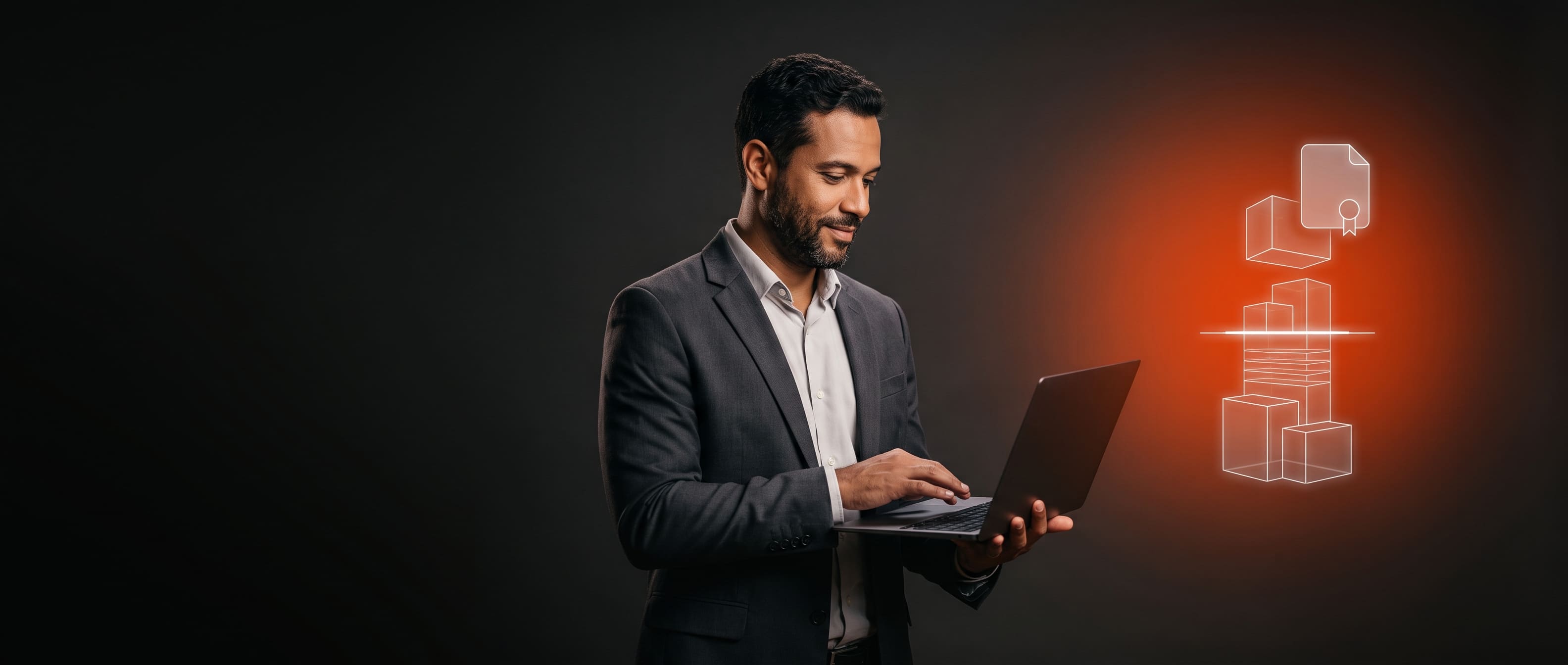 Homem de terno, barba e cabelos escuros segurando um notebook ao lado de uma figura 3d